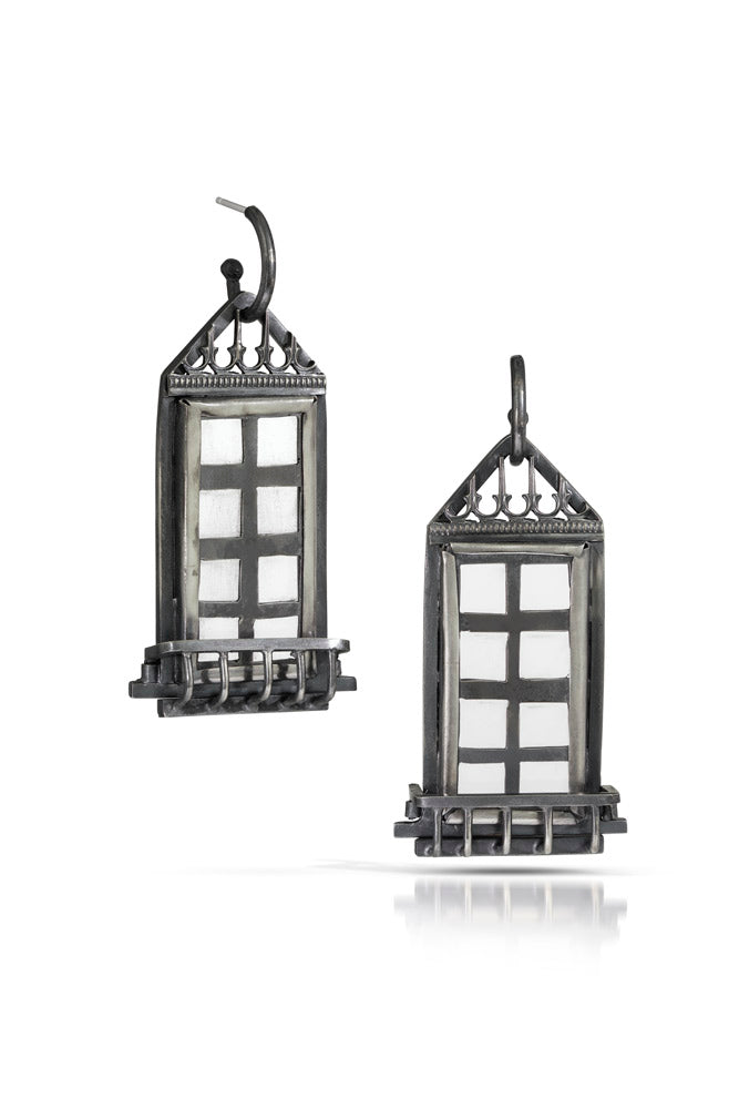 A pair of one of a kind statement window shaped earrings with long rectangle panels and decorative elements and window boxes. Oxidized sterling silver with crystal quartz for window panels.