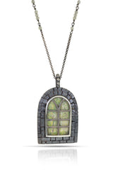 A rounded arch window necklace in oxidized sterling silver, with crystal quartz  as window panels and woody green tree drawings on background. Blacked finished textured "bricks" frame the window. On oxidized sterling silver rolo chain with labradorite cute accents.