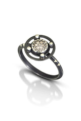 6mm pavé diamond charm is set into silver bezel, and circular frame with silver dots, on oxidized triangle sterling silver ring. Photo Credit: Cold Rodger Photography