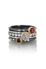 A set of 5 rings a more delicate version - one 6mm pavé diamond set in 14k gold bezel on oxidized and highlighted sterling silver beaded band, one 5mm Rosecut red garnet in 14k gold bezel on oxidized sterling silver triangle band, one 4mm Rosecut smiley quartz on oxidized sterling silver triangle band, and two oxidized and highlighted sterling silver bands in between the three stone rings to complete the ensemble.