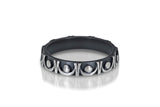 Oxidized silver ring band with continuous shiny silver trellis motif relief against blackened finish for everyday use as well as for special occasions such as wedding, engagement, birthdays, mother's day, and holidays. Photo by Cole Rodger.