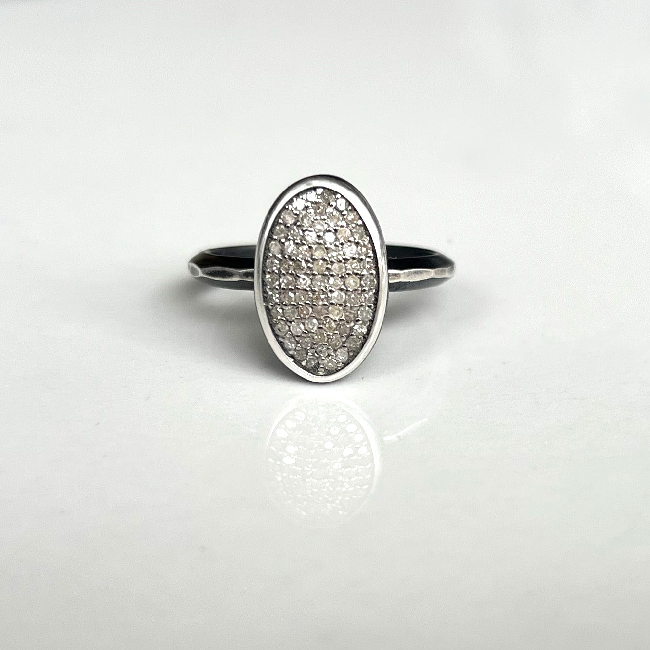 Oval Pavé Diamond set into fine silver bezel, soldered onto heavy hammered triangle wire, that's been oxidized sterling silver. Photo Credit: Cole Rodger Photography