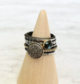 A set of 5 rings, one with 10mm pavé diamond disc set into 14k gold bezel with 14k beaded oxidized sterling silver band, one 6mm rose cut blue topaz set into 14k gold bezel with hammered oxidized sterling silver beaded band, one skinny triangle oxidized and highlighted sterling silver band separating the two stone rings, sandwiching both ends are two heavy hammered oxidized sterling silver bands, for a decorative classic look to complete your outfit.