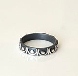 Oxidized silver ring band with continuous shiny silver trellis motif relief against blackened finish for everyday use as well as for special occasions such as wedding, engagement, birthdays, mother's day, and holidays.