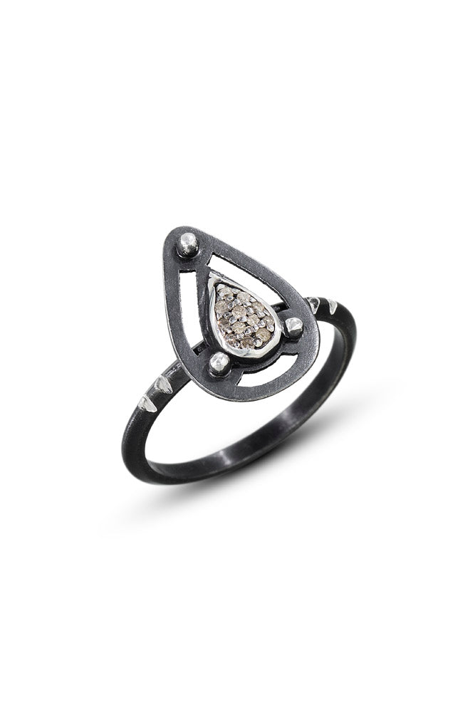 A teardrop shape pavé diamond is set into oxidized sterling silver teardrop shape and triangle ring shank. Photo Credit: Cole Rodger Photography