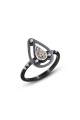 A teardrop shape pavé diamond is set into oxidized sterling silver teardrop shape and triangle ring shank. Photo Credit: Cole Rodger Photography