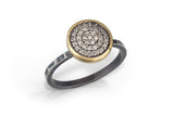 10mm Pavé Diamond charm is set into 14k gold bezel, a tops a hammered, oxidized sterling silver band. Enough bling to wear on its own, or add a set of stacking rings to dress it up. Photo Credit: Cold Rodger Photography
