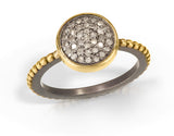 10mm Pavé Diamond ring set into 14k solid yellow gold bezel and on 14k gold beaded edging on oxidized sterling silver band. Enough bling for a party or special occasions. Photo Credit: Cole Rodger Photography