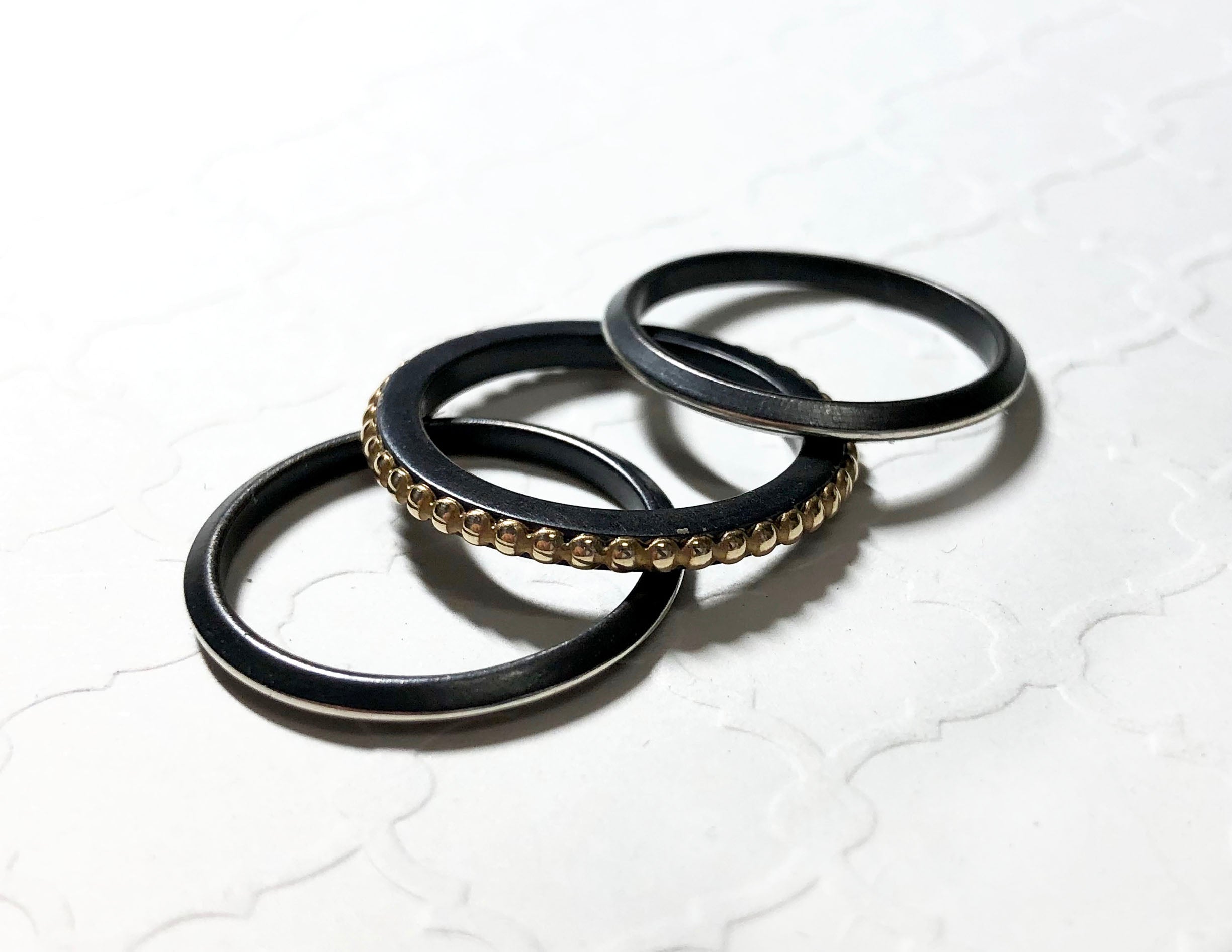 Stackable Ring Set of 3 - 14k yellow gold dotted band and oxidized sterling silver triangle bands for everyday wear.