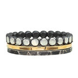 A set of three rings, one solid 14k yellow gold, one beaded oxidized sterling silver, and one hammered and oxidized steering silver. A perfect for everyday use.