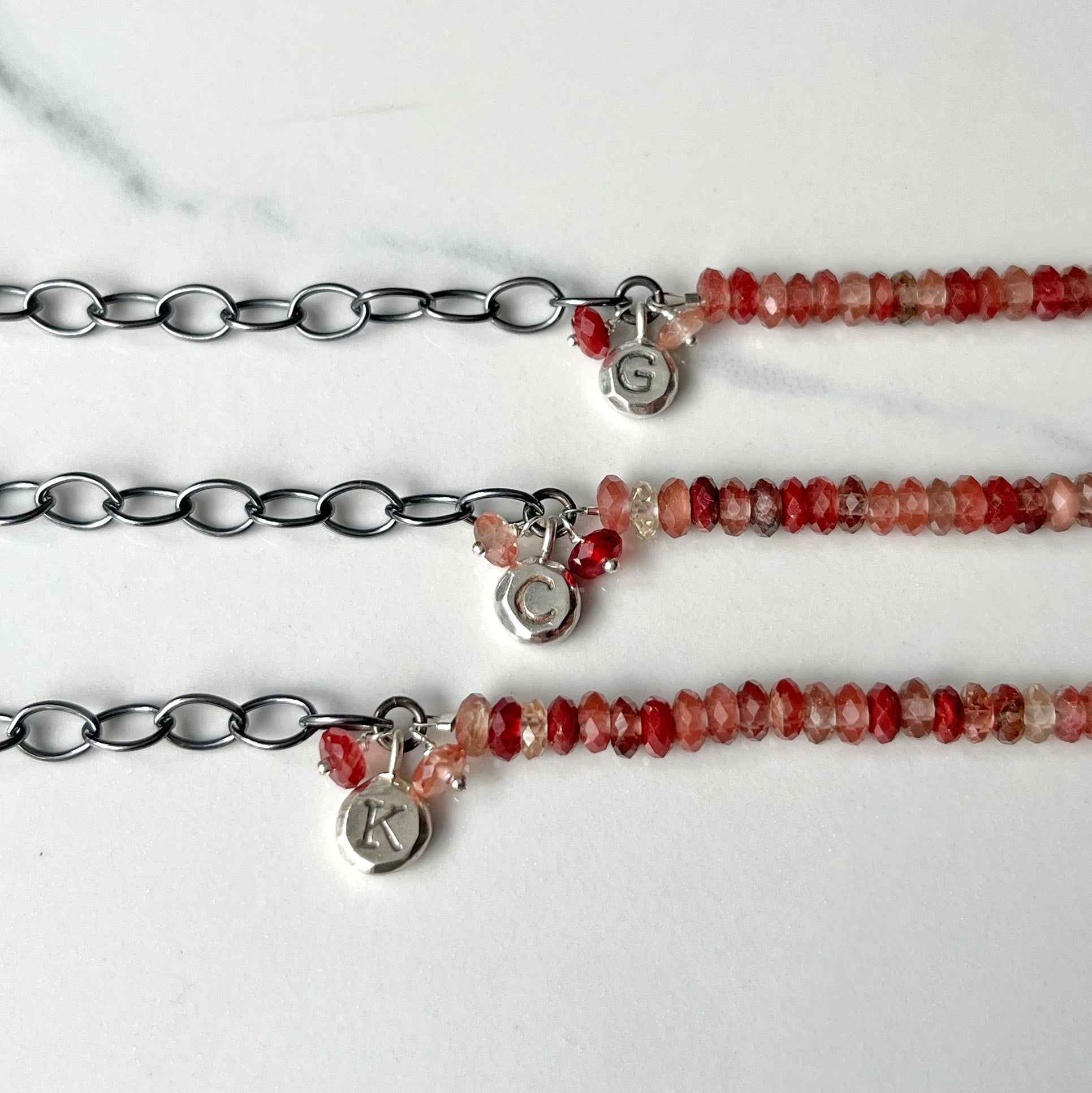 Aura Bracelet, Faceted Red Labradorite Gemstone with a customizable initial or a Zodiac Sign.