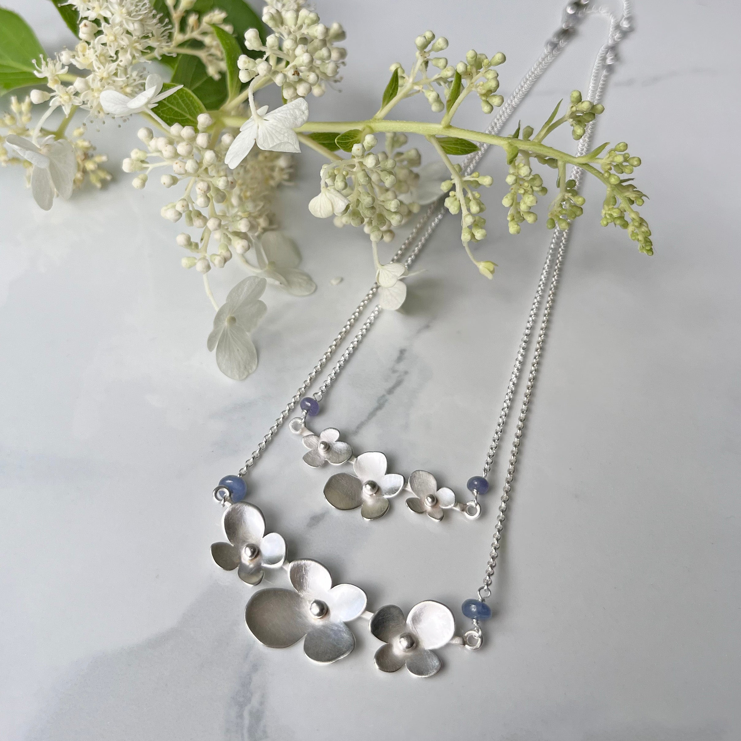Hydrangea Necklace with Tanzanite, The Trio Of Hydrangea Petals in Satin Silver with Tanzanite Blue Purple Accent. Elegant and Super Lightweight.